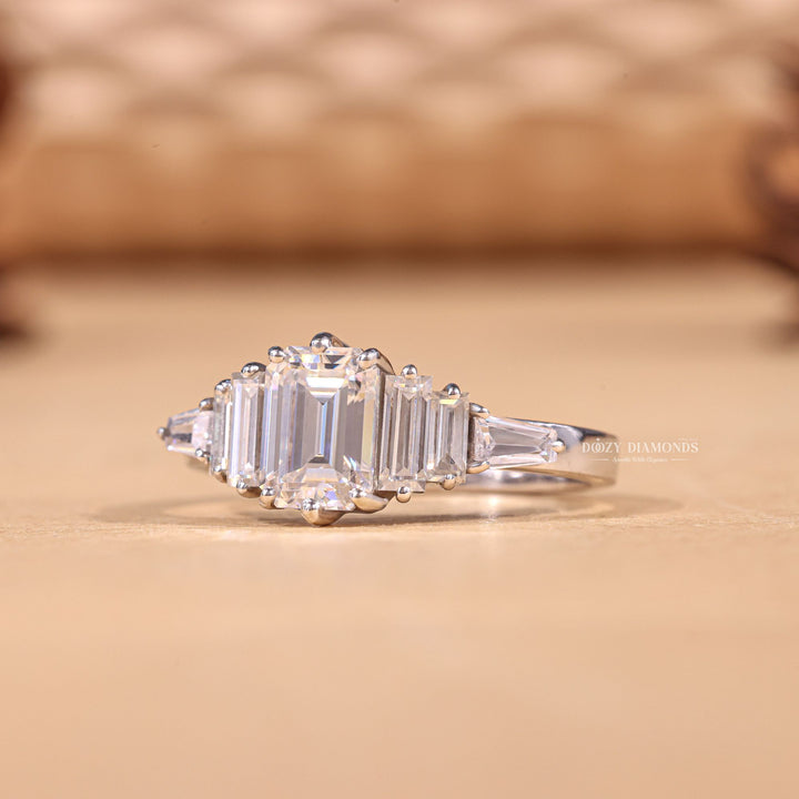 IGI certified emerald cut diamond in cluster engagement ring setting