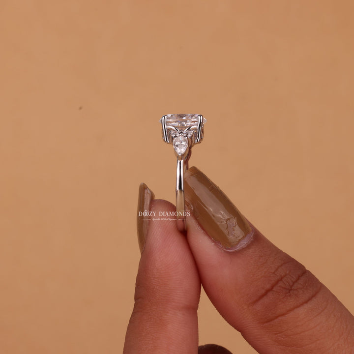 Lifestyle shot of oval cluster diamond ring on hand