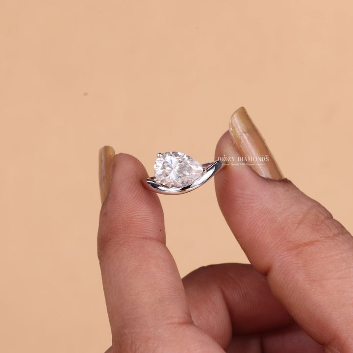 Pear solitaire engagement ring with brilliant diamond sparkle