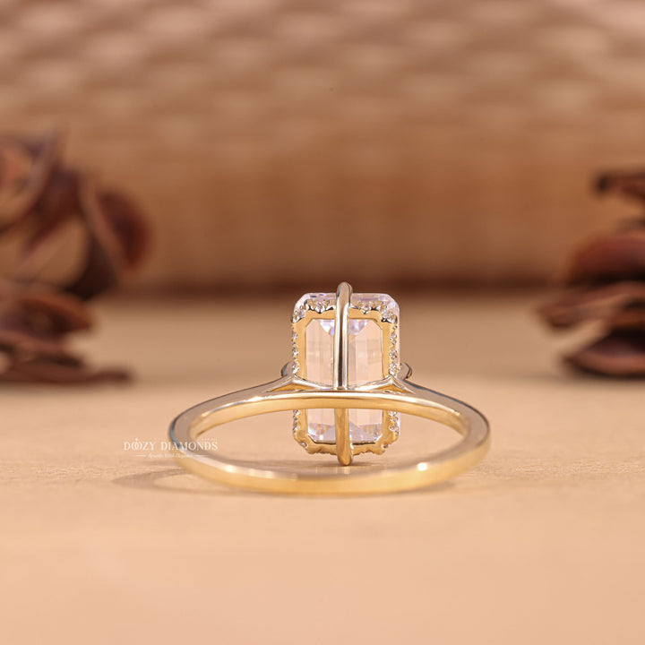 Unboxing view of emerald cut hidden halo diamond engagement ring