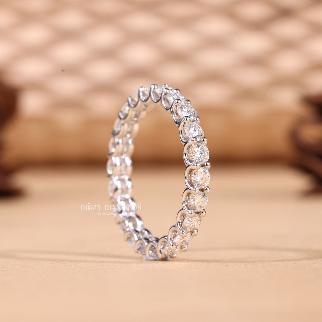 Round diamond band stacked with engagement ring