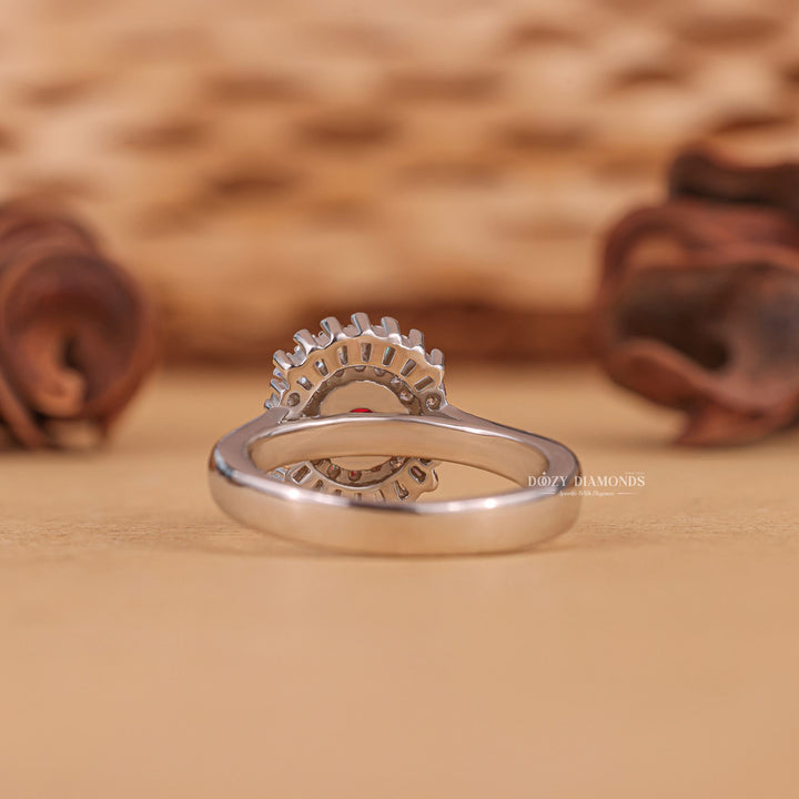 Round cut cluster engagement ring shown in real-life wear