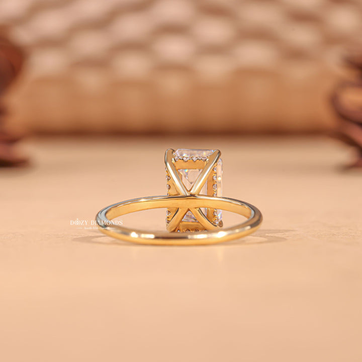Emerald hidden halo diamond ring presented in signature gift packaging