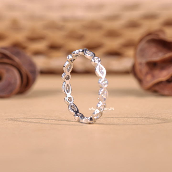Side view of round marquise diamond wedding band