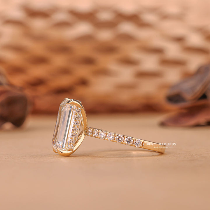Emerald hidden halo engagement ring shown on hand for true-to-life sizing