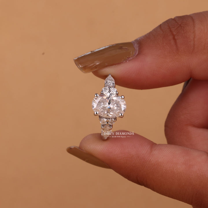 Oval cut cluster engagement ring with IGI certified center diamond