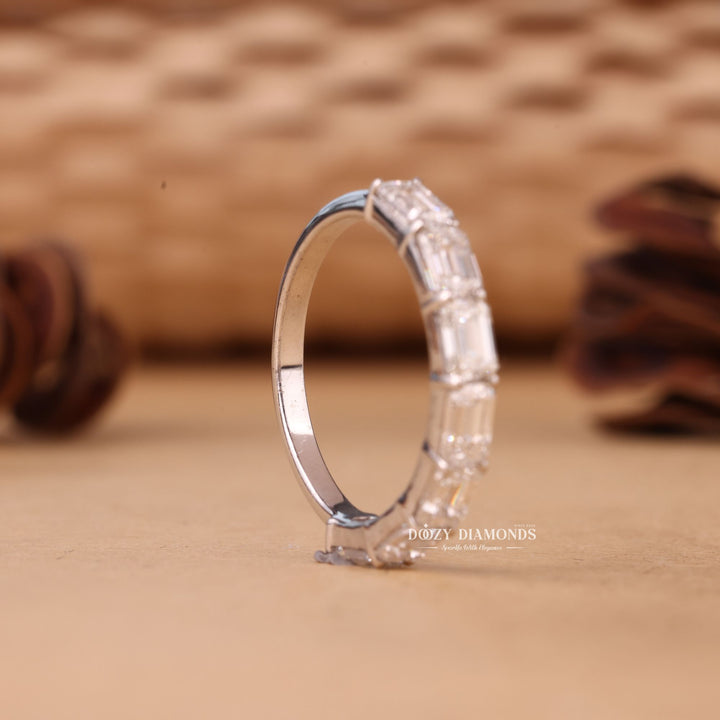 Emerald diamond band stacked with engagement ring