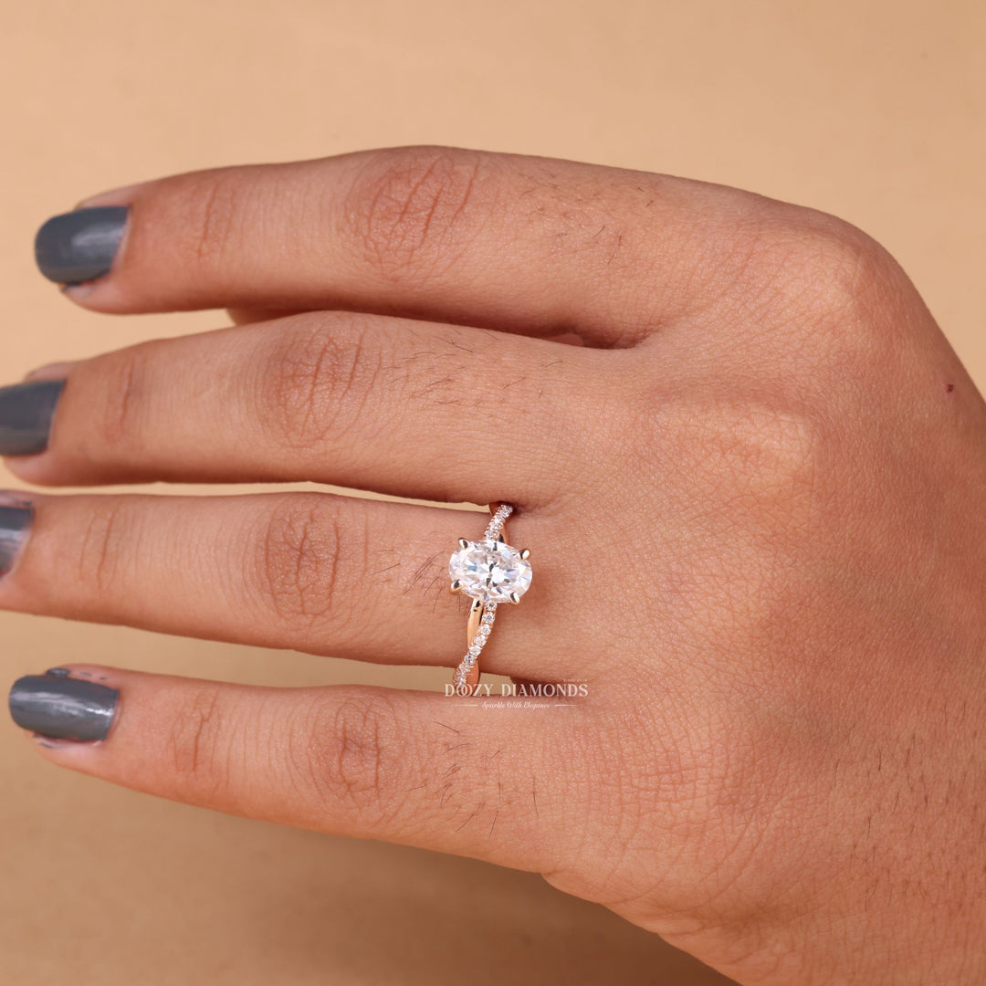 Oval solitaire lab grown diamond ring fitted on finger