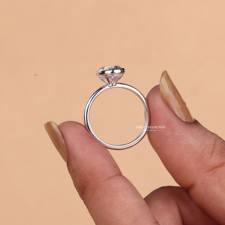 Fine craftsmanship detail on oval bezel engagement ring