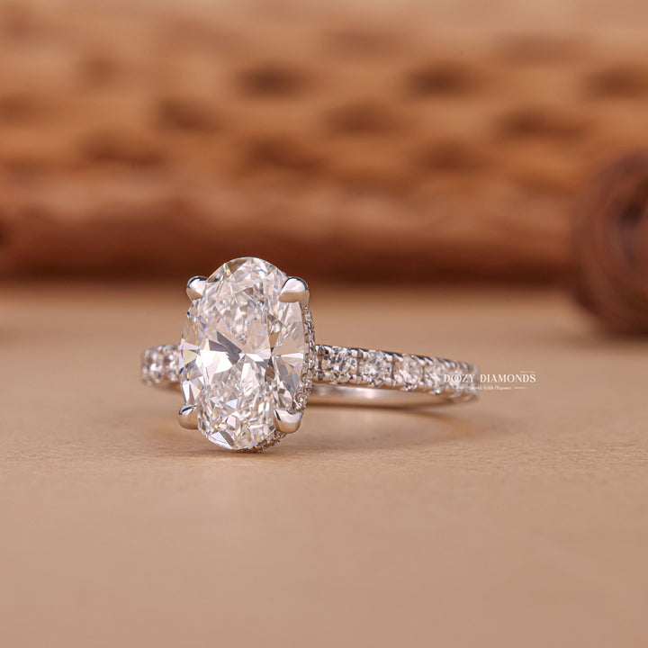 Oval hidden halo lab grown diamond ring side profile in gold setting