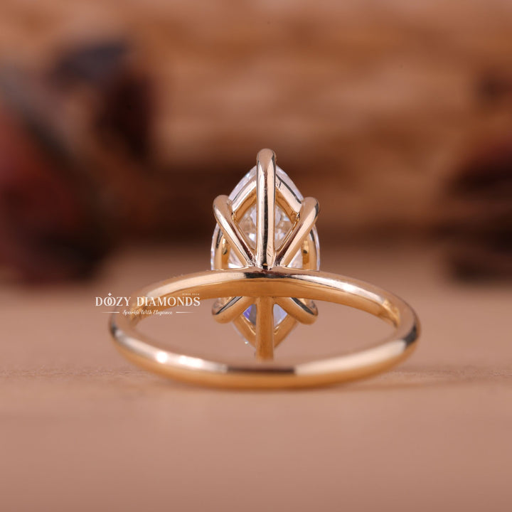 Marquise solitaire engagement ring photographed in natural light