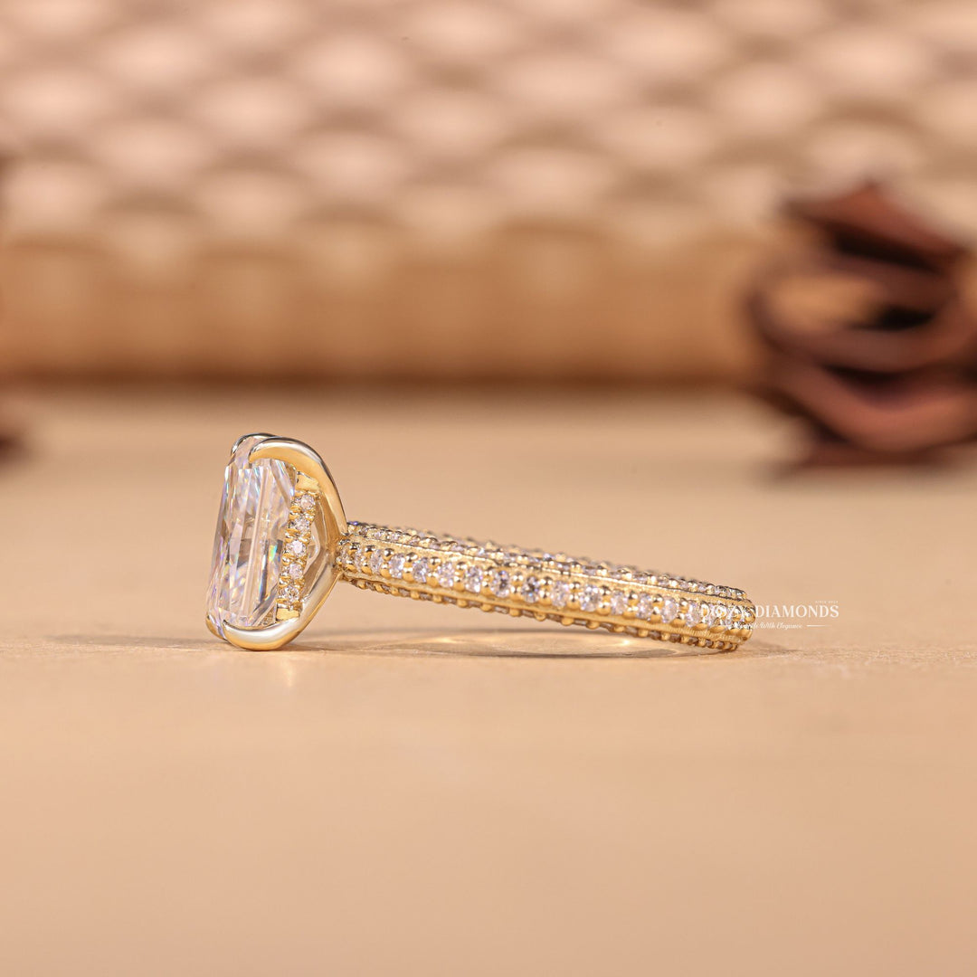 Angled view of radiant cut diamond in pave setting