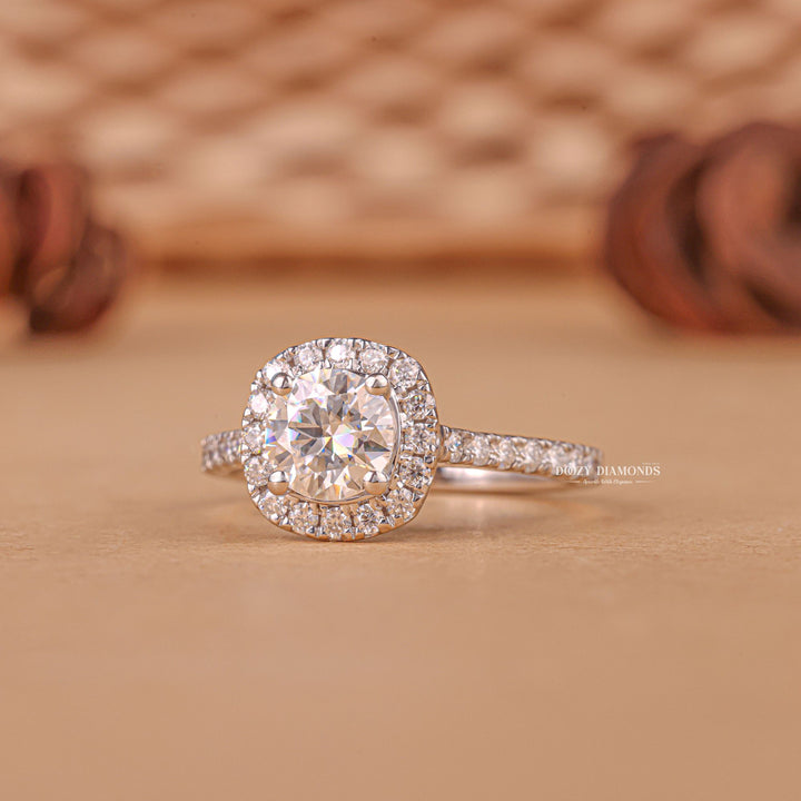 Close-up of round cut center diamond in halo engagement ring