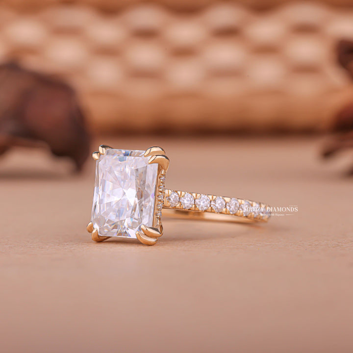 Radiant hidden halo engagement ring offered in gold and platinum