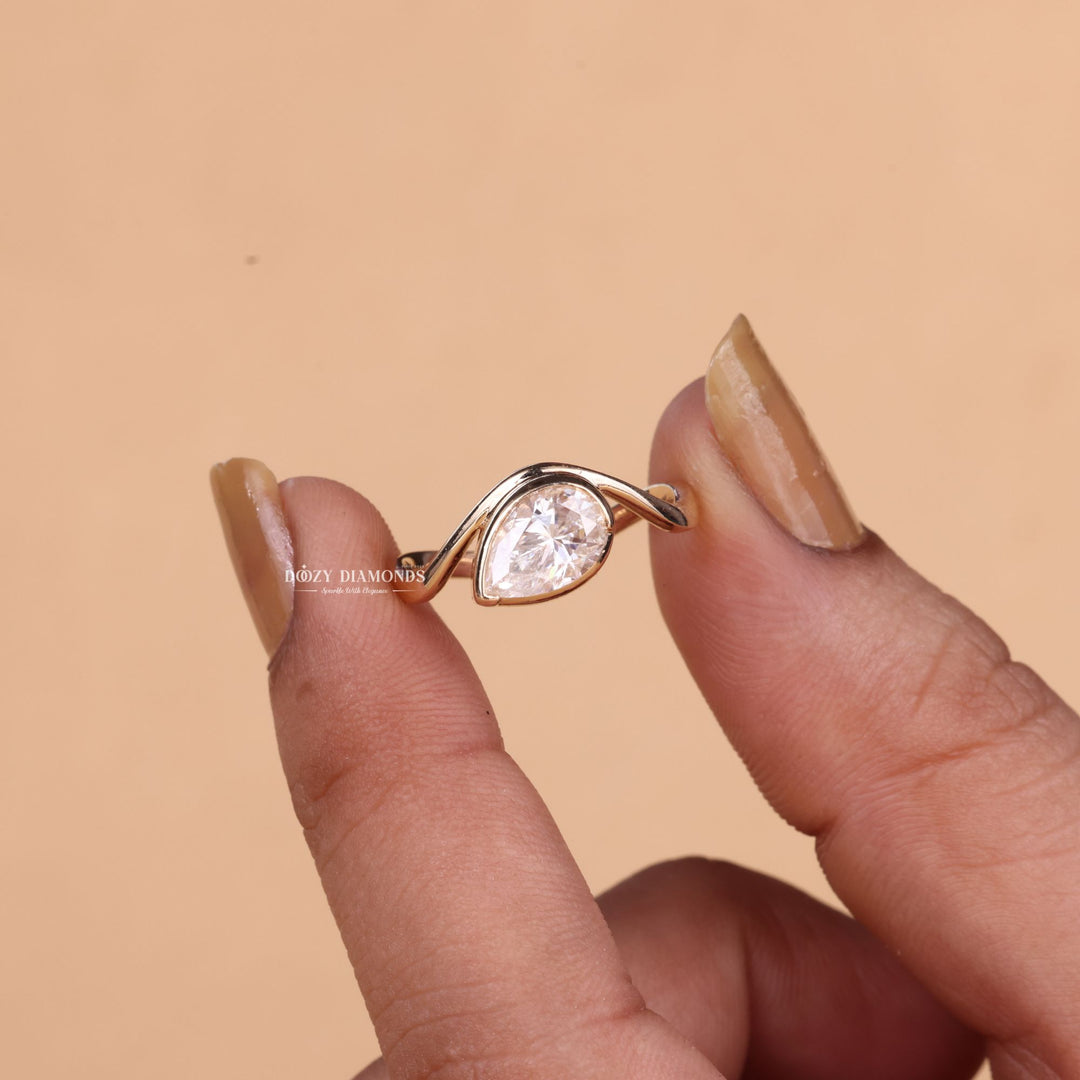 Marquise cut engagement ring shown with authenticity certificate