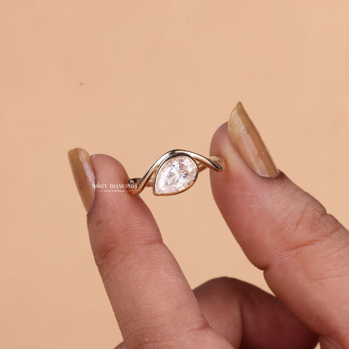 Marquise cut engagement ring shown with authenticity certificate