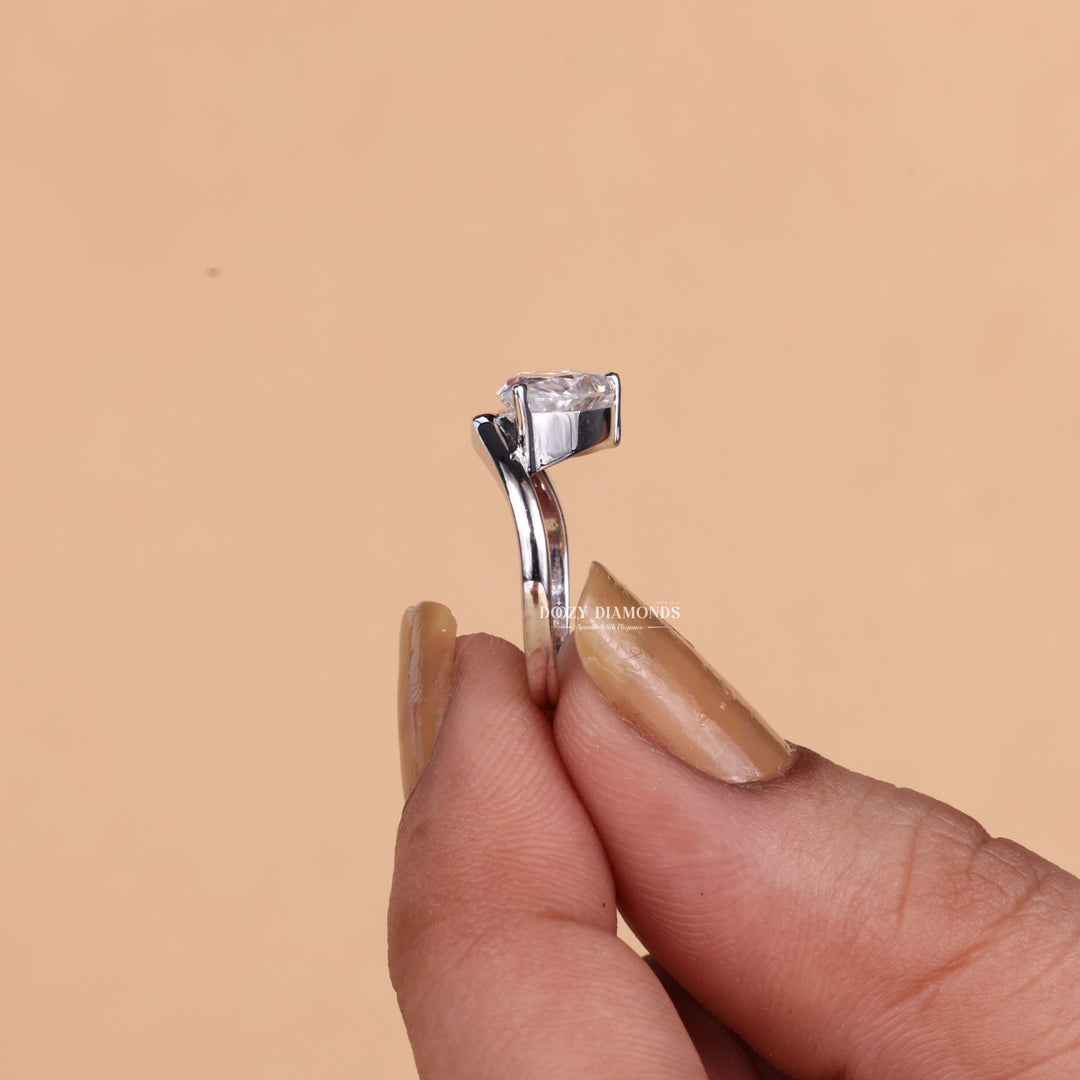 Angled view of pear cut diamond in solitaire setting
