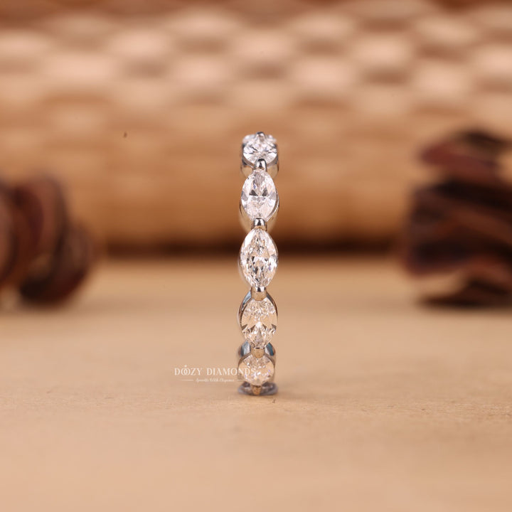 Ethically sourced pear diamond eternity band