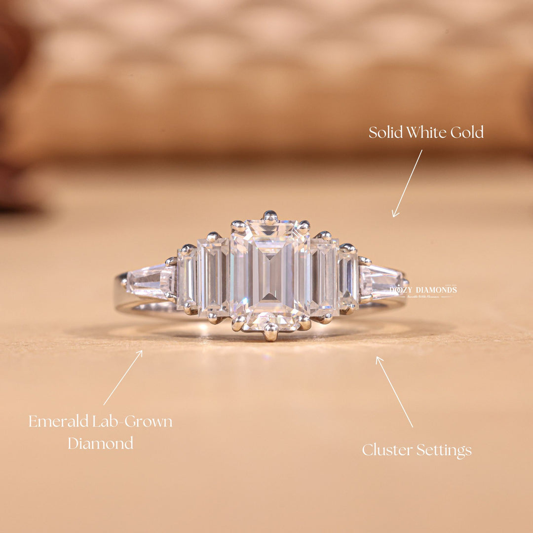 Certified emerald cut diamond featured in cluster engagement ring