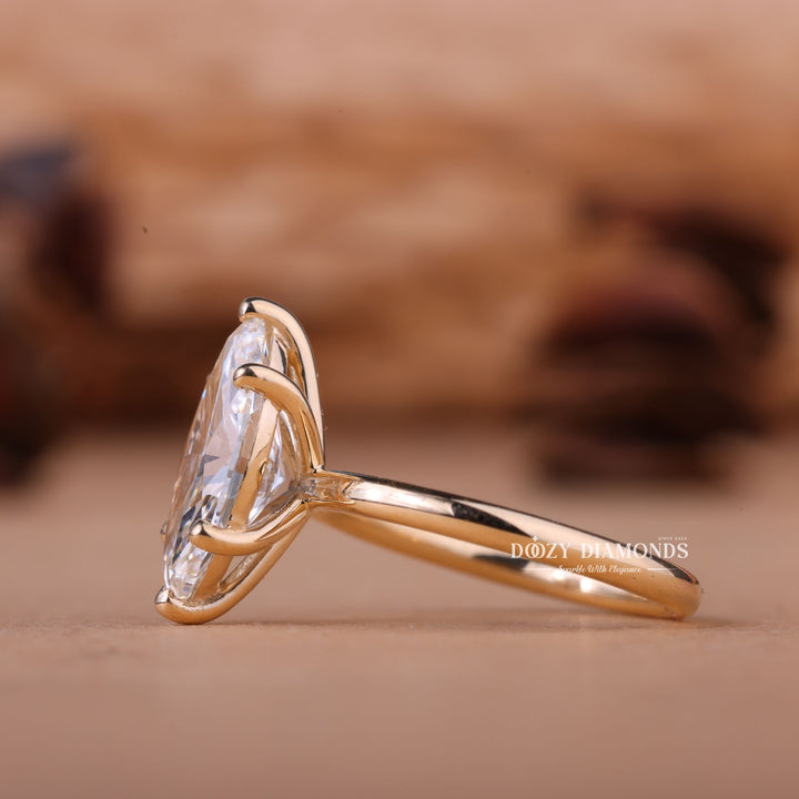 Fine craftsmanship detail on marquise solitaire engagement ring