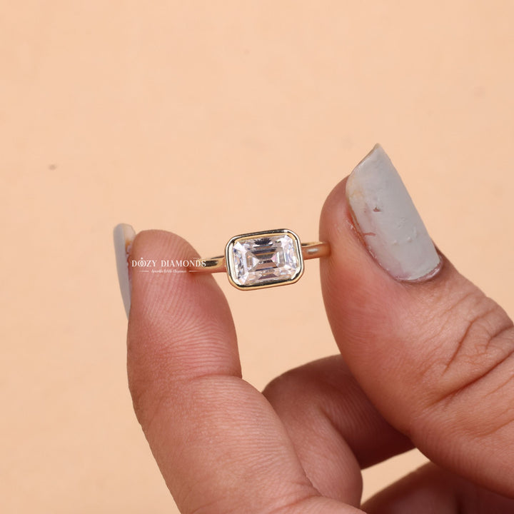 Emerald bezel lab grown diamond ring fitted on finger