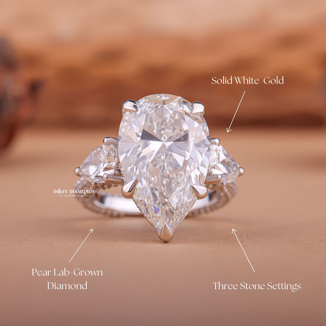 Handcrafted pear cut three stone lab grown diamond engagement ring