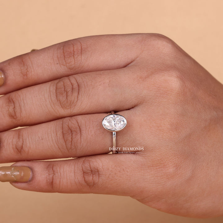 Premium oval cut bezel engagement ring crafted in solid gold