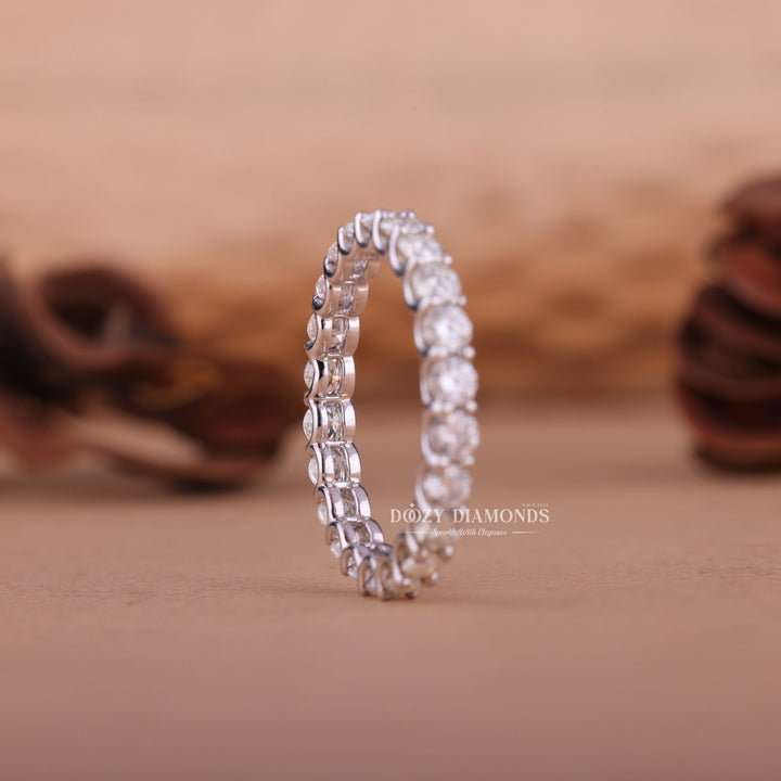 Round diamond band stacked with engagement ring