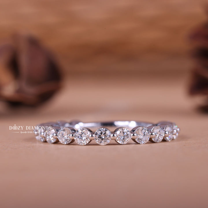 Round diamond band stacked with engagement ring