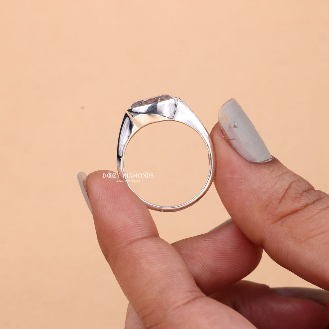 Lifestyle shot of oval east west diamond ring on hand