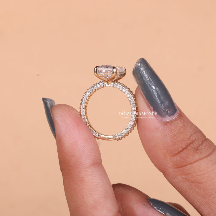 Close-up of radiant cut center diamond in pave engagement ring