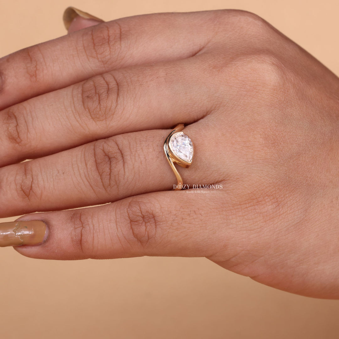 Marquise bezel diamond ring presented in signature gift packaging