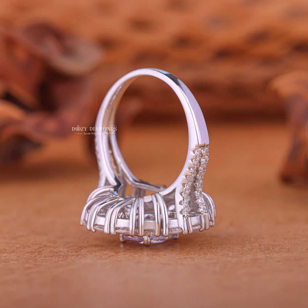 Oval cluster engagement ring close-up showing F/VS1 diamond clarity