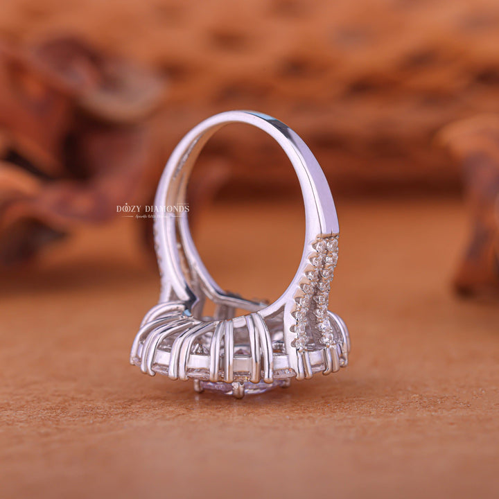 Oval cluster engagement ring close-up showing F/VS1 diamond clarity