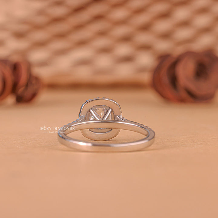 Detailed close-up of round halo diamond engagement ring