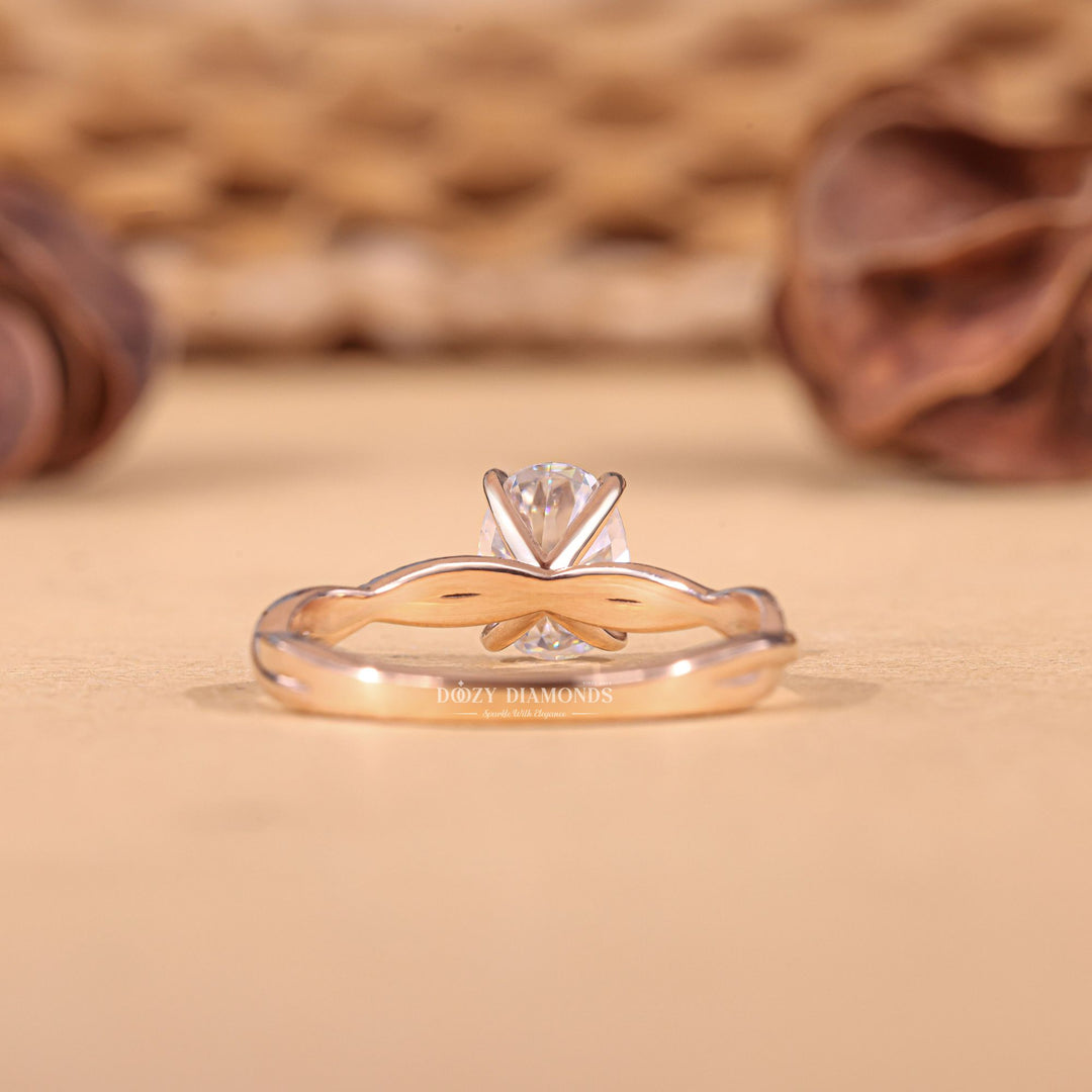 Oval cut diamond ring worn on hand