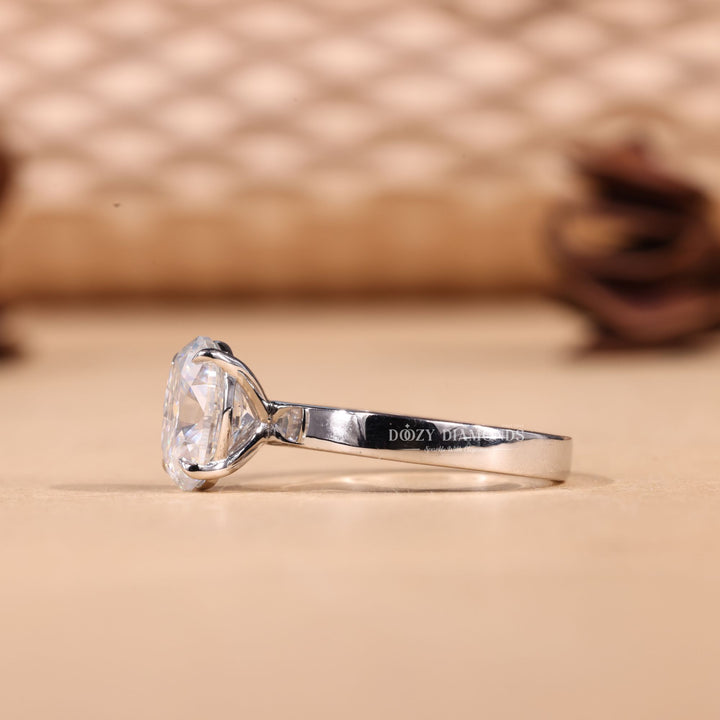 Oval solitaire diamond ring presented in signature gift packaging