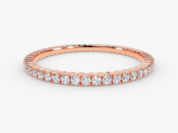 Round diamond band stacked with engagement ring