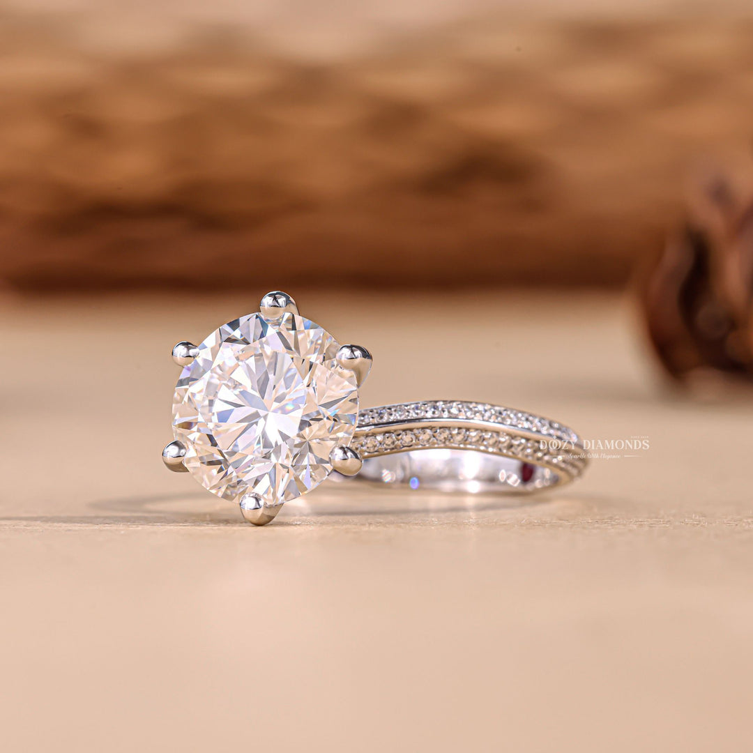 Round cut pave engagement ring shown in real-life wear