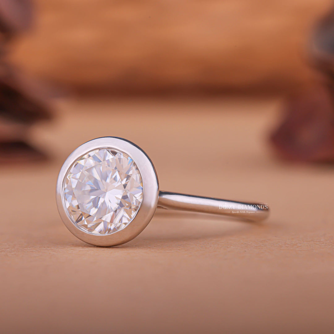 Shop the round cut bezel engagement ring collection online