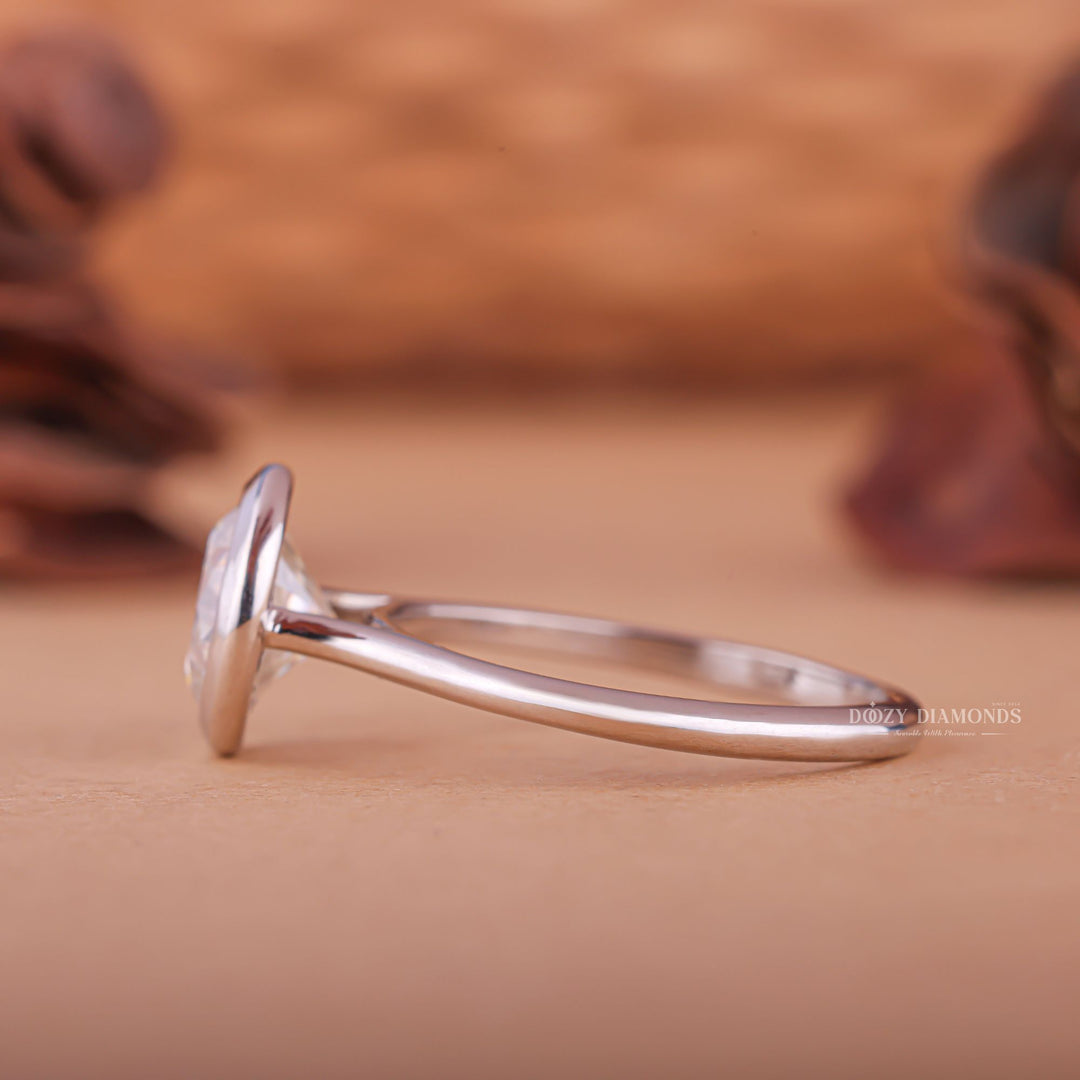 Round cut engagement ring shown with authenticity certificate