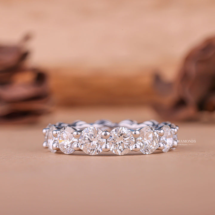 Round diamond band stacked with engagement ring