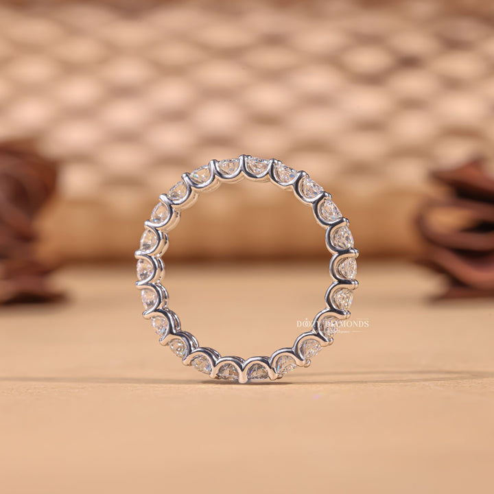 Round diamond band stacked with engagement ring