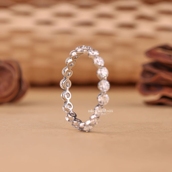 Floating Bubble diamond band stacked with engagement ring