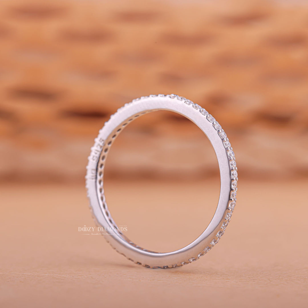 Eternity diamond band stacked with engagement ring