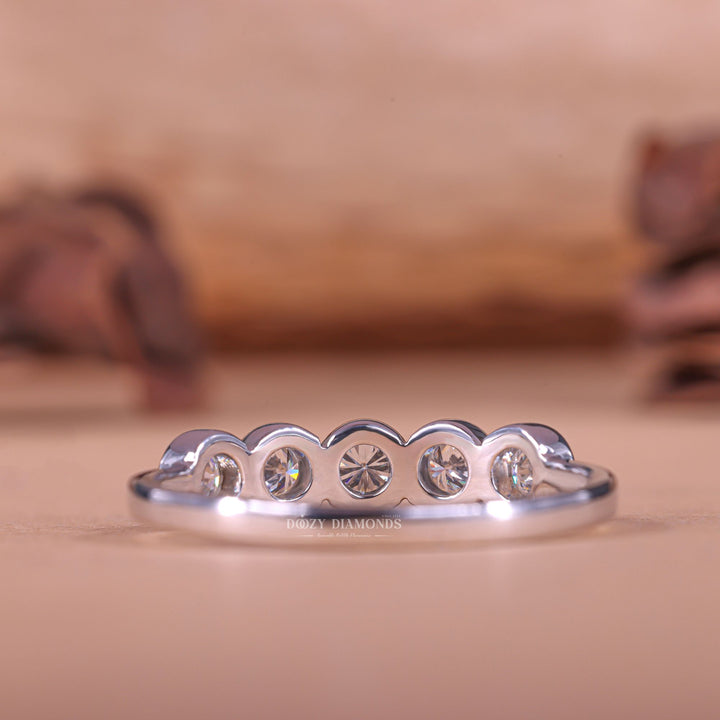 Round diamond band stacked with engagement ring