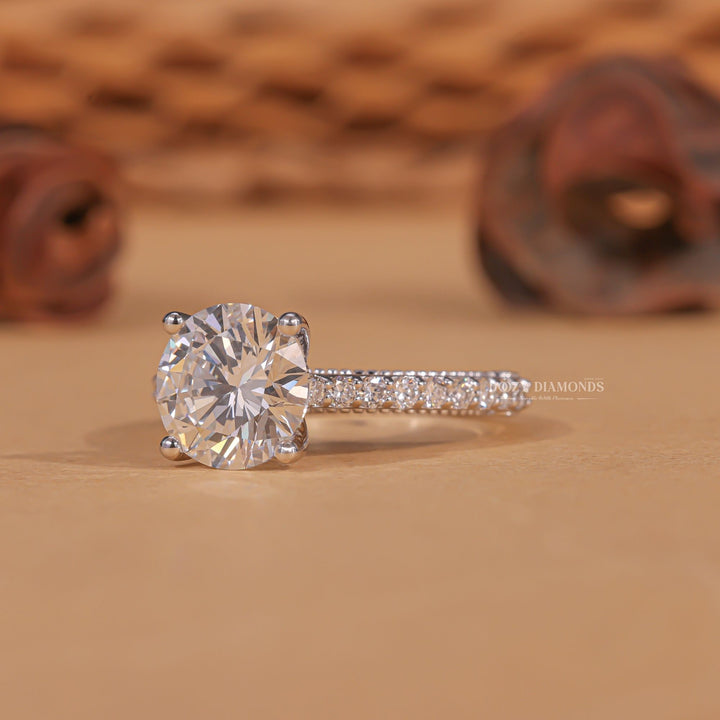 Round milgrain engagement ring offered in gold and platinum