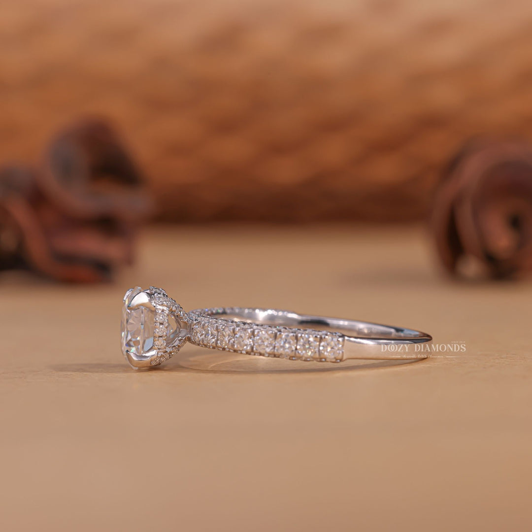 Detailed close-up of round pave diamond engagement ring