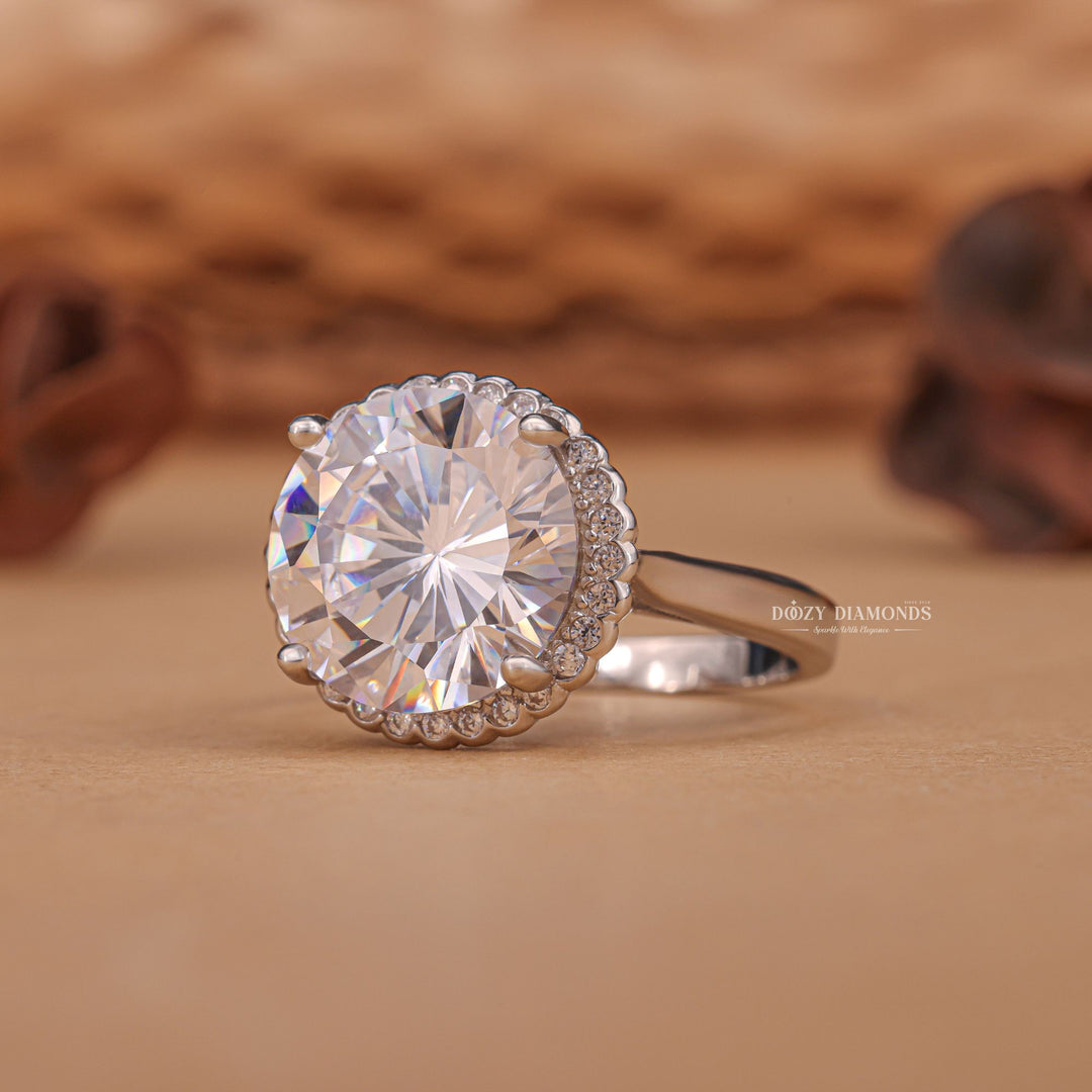 Round halo engagement ring offered in gold and platinum