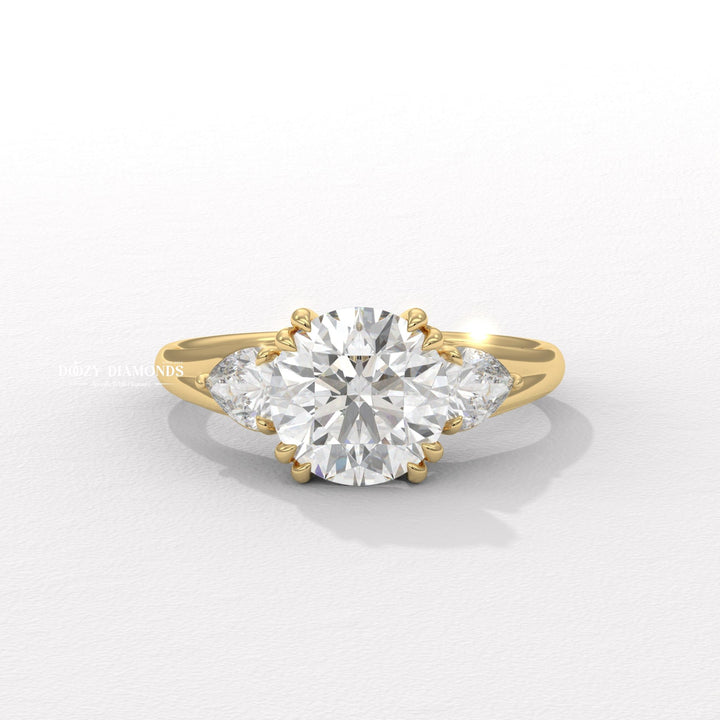 Round cut three stone engagement ring available to buy now